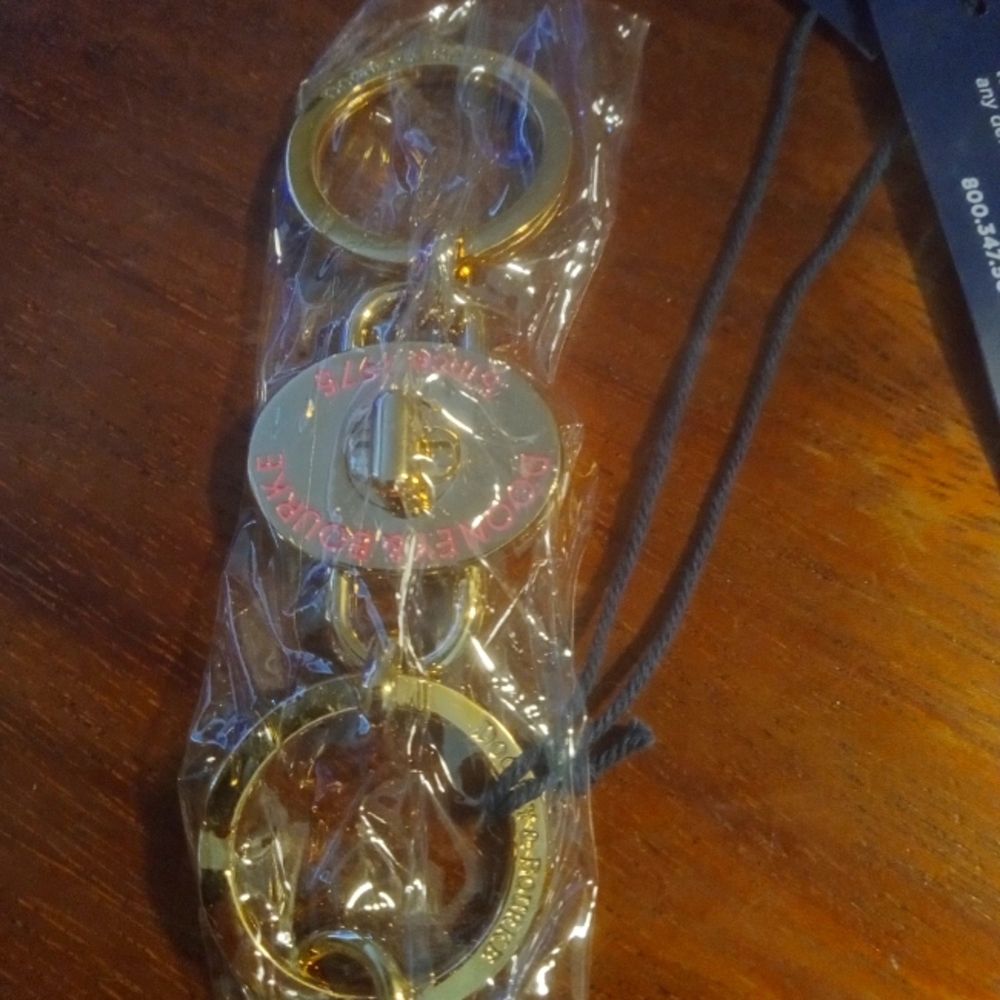 NWT STILL IN PLASTIC DOONEY AND BOURKE KEY FOB